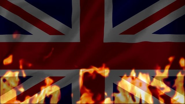 Fire burning the union-jack flag of united kingdom