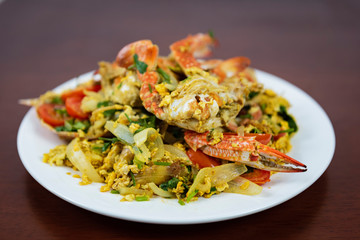 Stir Fried Crab with Curry Powder, Closeup, Thai Food on a wooden background