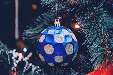 Beautiful Christmas decorations hanging on a Christmas tree. Home decoration for Christmas