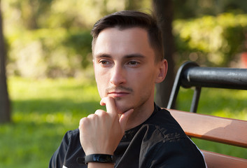 portrait of a serious young man. a young brunet male wondered, emotion, concentration and...