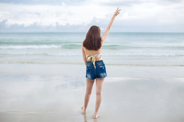 Portrait of young woman on the tropical beach