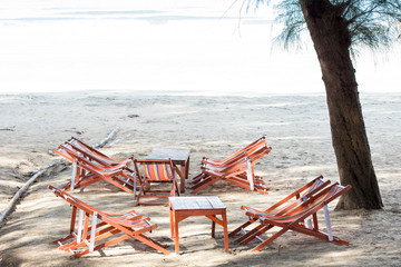 the sand beach with beach chairs