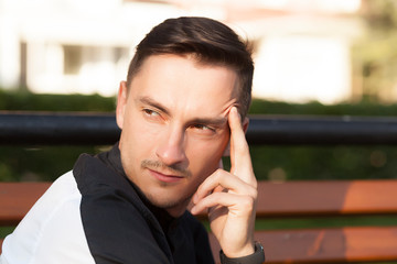 portrait of a serious young man. a young brunet male wondered, emotion, concentration and...