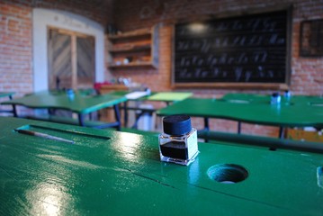 The ink stands on the desk in the calligraphy class, Poland