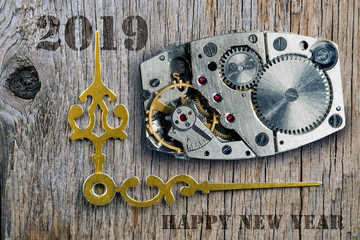 The clock mechanism, Arrows of hours and the New Year