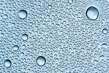 Water drops on a bright surface