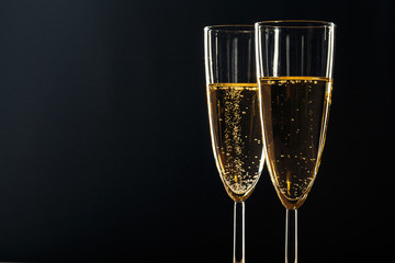 Champagne glasses for festive occasion against a dark background
