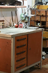 Fototapeta na wymiar Hand tools on the table and shelf in messy home workshop
