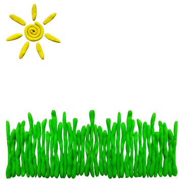Plasticine grass and sun isolated on white background