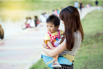 beautiful mother playing with her baby boy