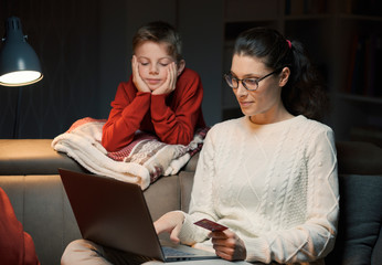 Mother and son doing online shopping together