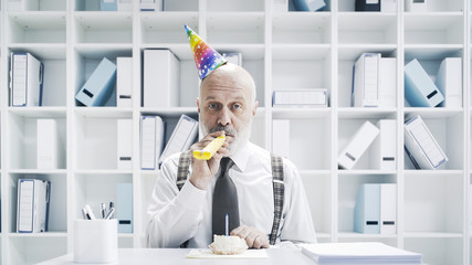 Senior businessman having a sad lonely birthday