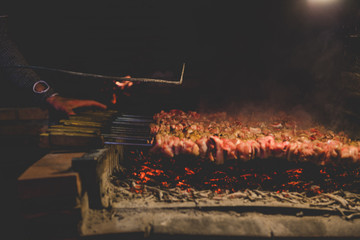 traditional lamb cooking over fire