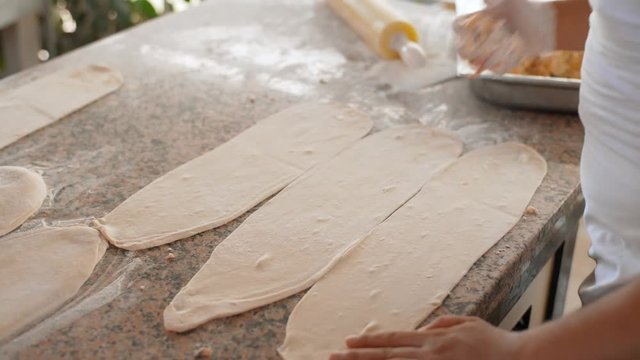A man prepares delicious traditional Turkish cakes Pida. 4k
