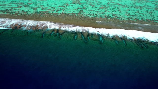 Aerial view of Tupai Heart Island coral reef atoll in French Polynesia