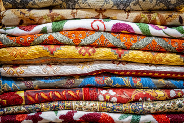 Various colorful cloth in stack in Grand Bazaar, Istanbul, Turkey