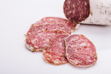 Saucisson sec delicious french salami on a white background