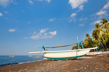 White boat on the shore in Sunny weather.