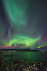 The polar arctic Northern lights aurora borealis sky star in Norway Svalbard in Longyearbyen city  mountains