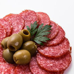 delicious sliced salami on a white background