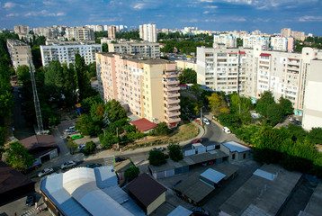 Odessa, Ukraine - August 8, 2018. Aerial view of a large high-rise city building plan, parking lot and patios. Garages downstairs in the background.