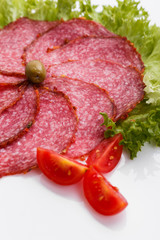 delicious sliced salami on a white background