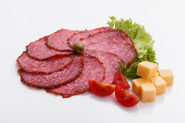 delicious sliced salami on a white background
