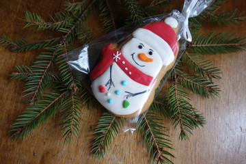 Winter holidays decoration - gingerbread snowman and spruce tree