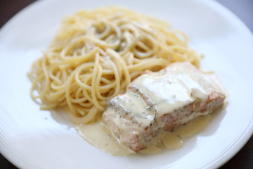 Grilled salmon with lemon cream sauce with pasta