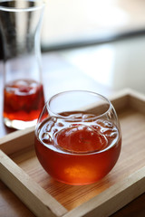 Strawberry iced tea on wooden table