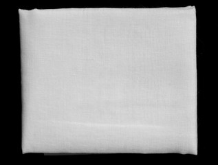 white fabric fold on black background