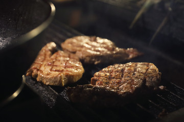 Cooking steak in close up