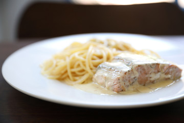 Grilled salmon with lemon cream sauce with pasta