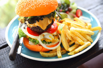 Beef hamburger fastfood on wooden table