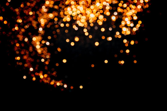Magic lights christmas bokeh on black background.