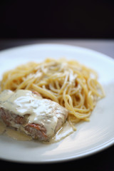 Grilled salmon with lemon cream sauce with pasta