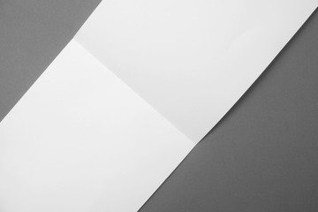 fold white paper on gray background