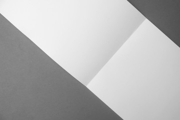 fold white paper on gray background