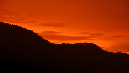 Mountain silhouette and sunset in Lake Toba, Sumatra, Indonesia.