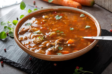 Eastern Europe traditional sour soup or borsch made with beef meat and vegetables