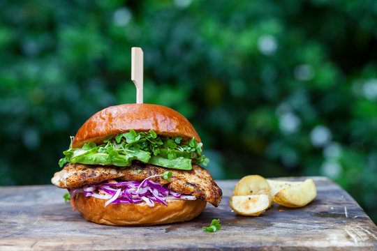 Chicken burger with red cabbage coleslaw and avocado