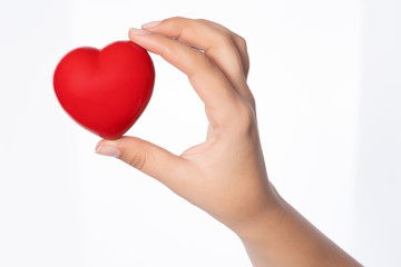 Fototapeta premium Healthcare concept, female holding heart with love in her hands