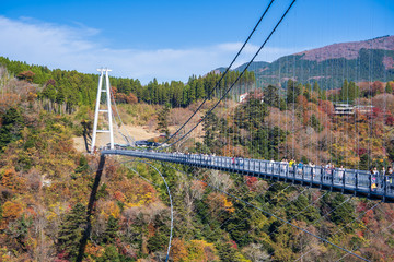 Fototapeta na wymiar Kuju, oita, Japan, November 11, 2018: Kokonoe Yume Suspension Bridge (otsurihashi), the most highest suspension bridge for walkway in Japan.
