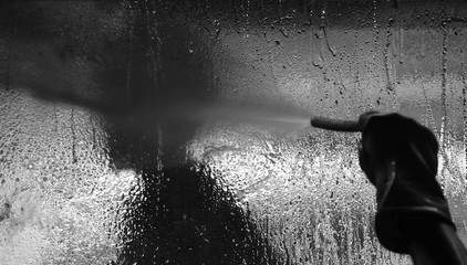 Obraz premium black and white silhouette of a window washing