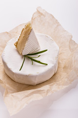 delicious creamy camembert cheese on a white background