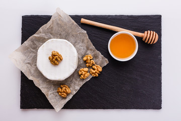 delicious creamy camembert cheese on a white background
