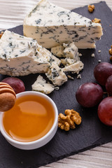 delicious blue cheese on wooden rustic background