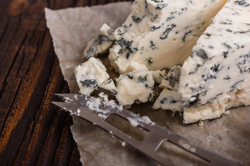 delicious blue cheese on wooden rustic background