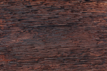 Beautiful wooden background. Of rustic aspect and dark, ocher, brown, toasted, black tones. The veins and knots are appreciated.