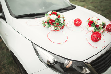 Wedding car decorated with beautiful, luxury flowers
